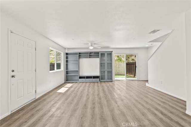26145 Gravett Pl, Saugus, CA 91350 - unfurnished living room featuring wood finished floors, visible vents, ceiling fan, and baseboards
