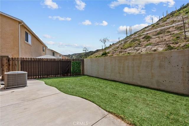 26145 Gravett Pl, Saugus, CA 91350 - view of yard featuring central AC, a patio, and a fenced backyard