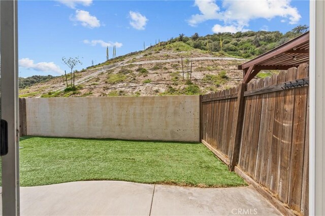 26145 Gravett Pl, Saugus, CA 91350 - view of yard featuring a patio and a fenced backyard
