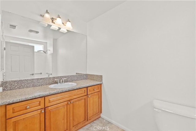 26145 Gravett Pl, Saugus, CA 91350 - bathroom with vanity, toilet, visible vents, baseboards, and walk in shower