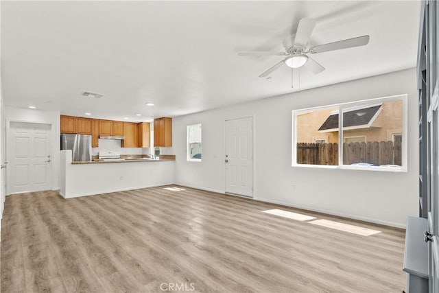 26145 Gravett Pl, Saugus, CA 91350 - unfurnished living room with light wood-style floors, ceiling fan, visible vents, baseboards, and recessed lighting