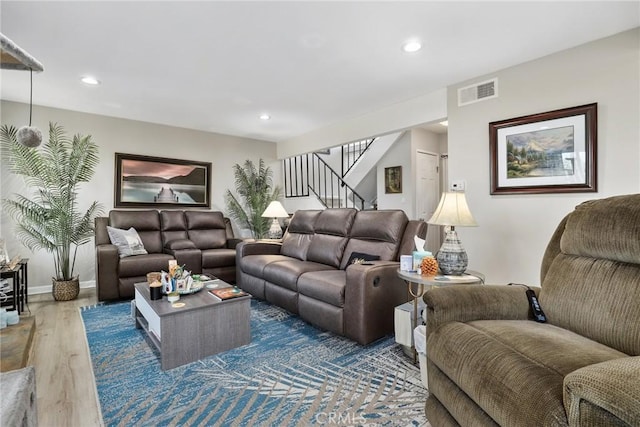 living room with visible vents, wood finished floors, stairway, and recessed lighting