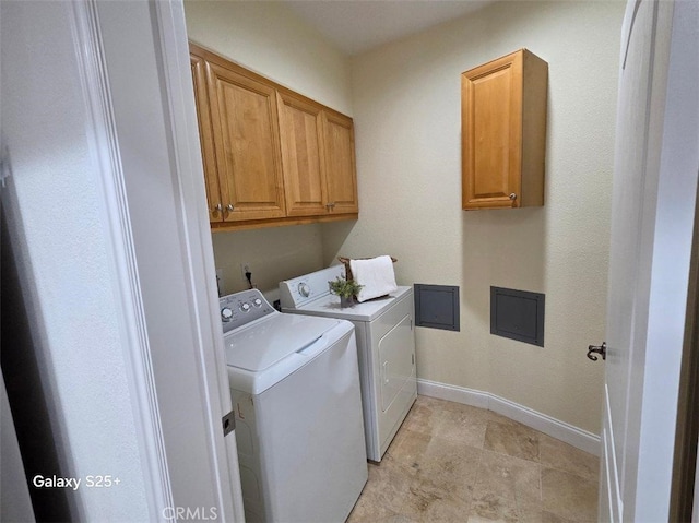 412 Arenoso Ln Unit 102, San Clemente, CA 92672 - washroom featuring independent washer and dryer, cabinet space, and baseboards