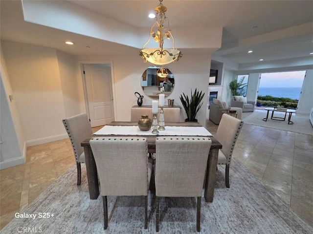 412 Arenoso Ln Unit 102, San Clemente, CA 92672 - dining area with recessed lighting, light tile patterned flooring, baseboards, and a fireplace