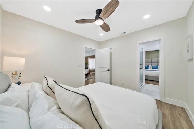 bedroom with visible vents, wood finished floors, baseboards, recessed lighting, and a ceiling fan