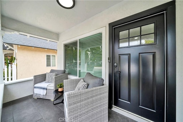 entrance to property with stucco siding