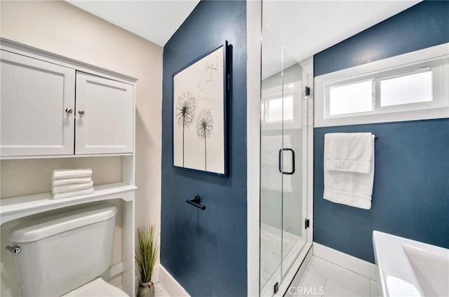 bathroom with toilet, baseboards, and a shower stall