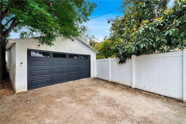 detached garage with fence