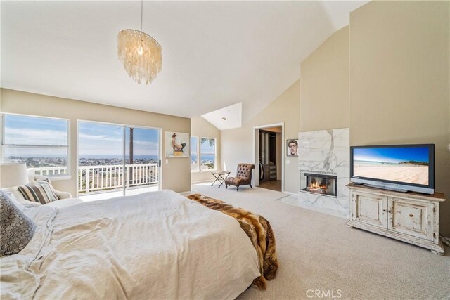 2009 Via Aguila, San Clemente, CA 92673 - bedroom featuring access to outside, lofted ceiling, a high end fireplace, and carpet