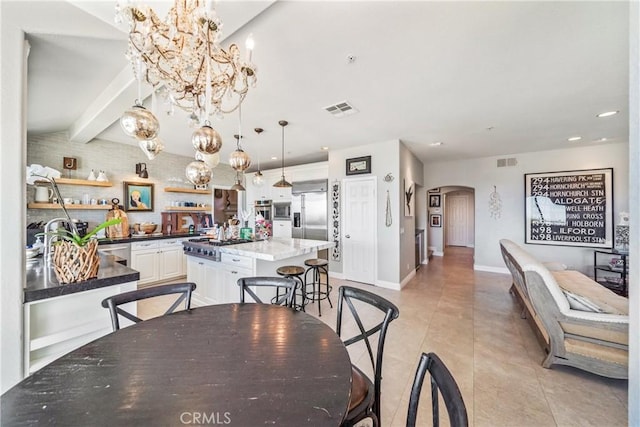 2009 Via Aguila, San Clemente, CA 92673 - dining room featuring arched walkways, a chandelier, recessed lighting, and light tile patterned floors