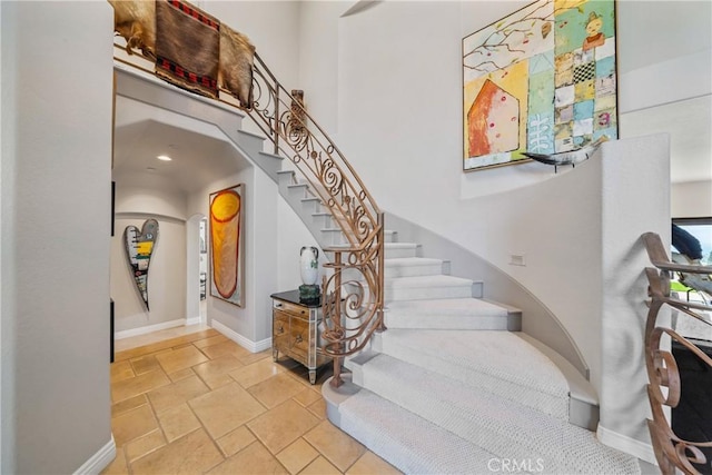 2009 Via Aguila, San Clemente, CA 92673 - stairway with stone tile flooring and a towering ceiling