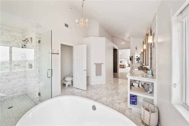 2009 Via Aguila, San Clemente, CA 92673 - bathroom with lofted ceiling, a soaking tub, a shower stall, a chandelier, and vanity
