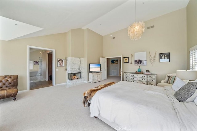 2009 Via Aguila, San Clemente, CA 92673 - bedroom with high vaulted ceiling, carpet flooring, a fireplace, a chandelier, and connected bathroom