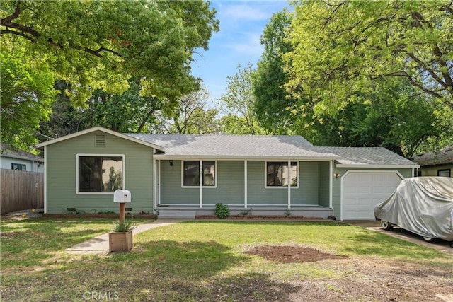 ranch-style house featuring a shingled roof, covered porch, an attached garage, fence, and a front lawn