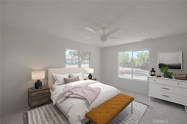 bedroom featuring carpet floors, ceiling fan, baseboards, and multiple windows