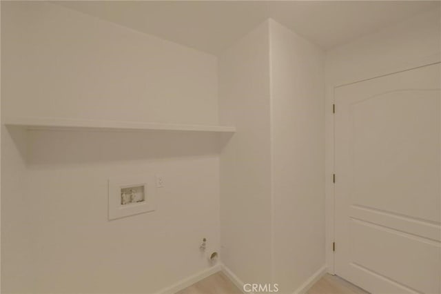 laundry area featuring hookup for a washing machine, laundry area, and baseboards