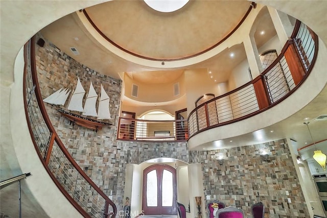 5455 E Sorrento Dr, Long Beach, CA 90803 - entrance foyer with stairway, arched walkways, and a high ceiling