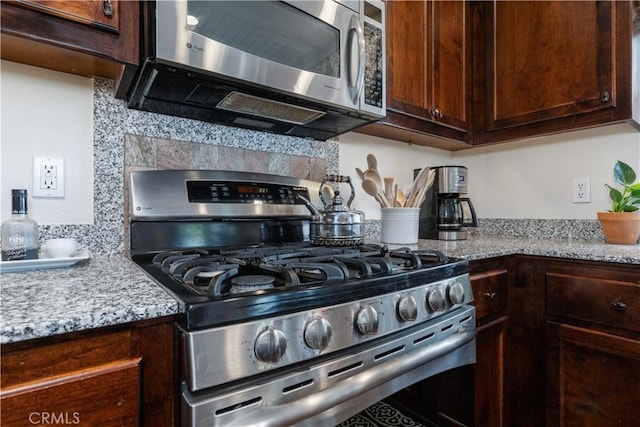 1835 Rancho Lomas Way, San Miguel, CA 93451 - kitchen with stainless steel appliances, dark brown cabinets, light stone countertops, and decorative backsplash