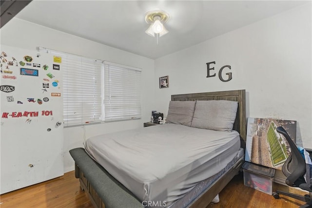 bedroom with wood finished floors