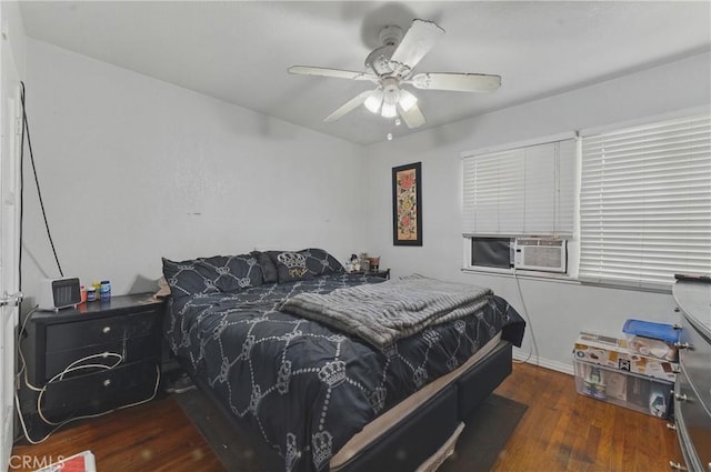 bedroom with a ceiling fan and wood finished floors