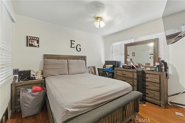 bedroom featuring wood finished floors