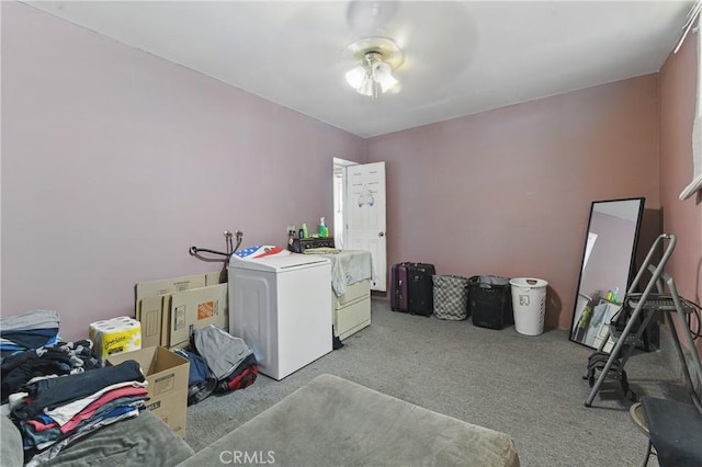 clothes washing area with laundry area, carpet, and washer and dryer