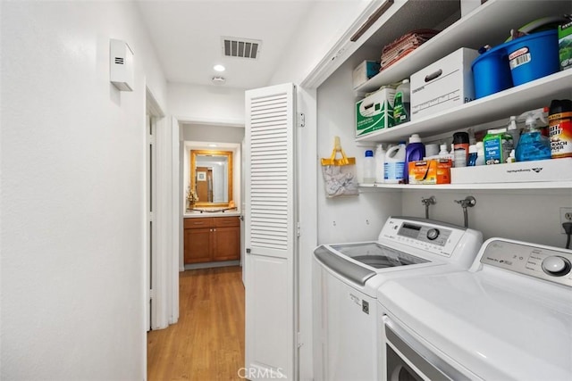 5472 Paseo Del Lago E Unit B, Laguna Woods, CA 92637 - washroom with washer and dryer, light wood-type flooring, and recessed lighting