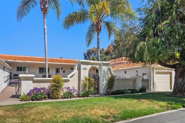 5472 Paseo Del Lago E Unit B, Laguna Woods, CA 92637 - view of front facade with a tiled roof, stucco siding, and an attached garage