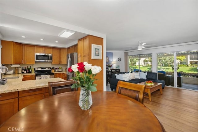 5472 Paseo Del Lago E Unit B, Laguna Woods, CA 92637 - dining room with light wood-style floors, a ceiling fan, and recessed lighting