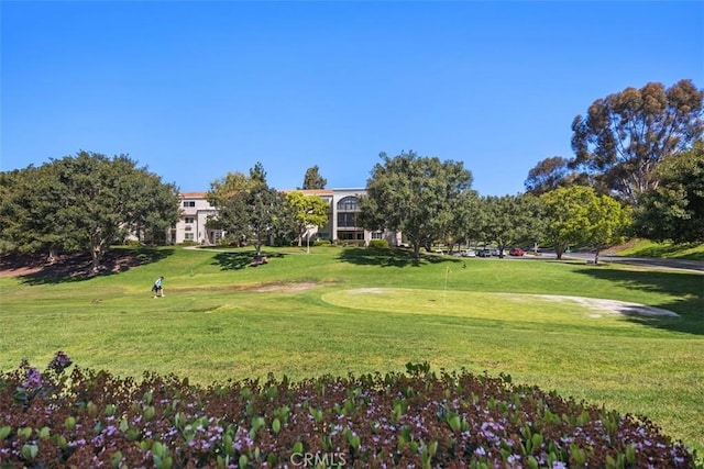 5472 Paseo Del Lago E Unit B, Laguna Woods, CA 92637 - view of home's community featuring a lawn, an area to practice putting, and view of golf course
