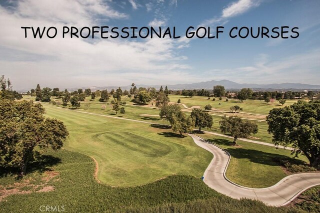 5472 Paseo Del Lago E Unit B, Laguna Woods, CA 92637 - view of community with a mountain view, golf course view, and a yard
