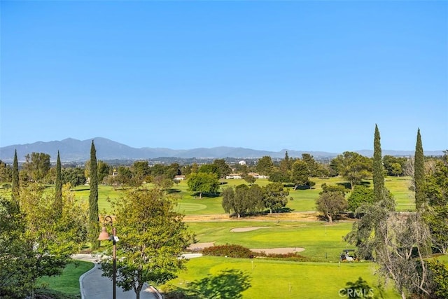 5472 Paseo Del Lago E Unit B, Laguna Woods, CA 92637 - surrounding community with a mountain view, a yard, and view of golf course