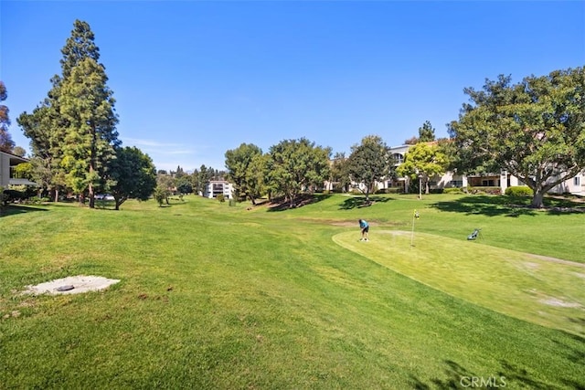5472 Paseo Del Lago E Unit B, Laguna Woods, CA 92637 - view of community with view of golf course and a lawn