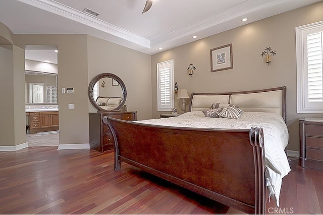 bedroom with recessed lighting, wood finished floors, ornamental molding, baseboards, and visible vents