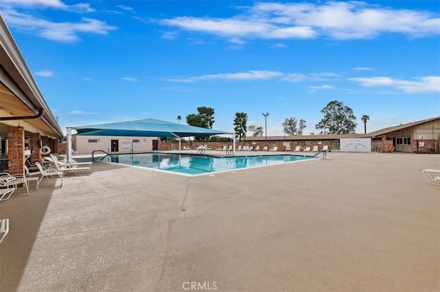 community pool featuring a patio area