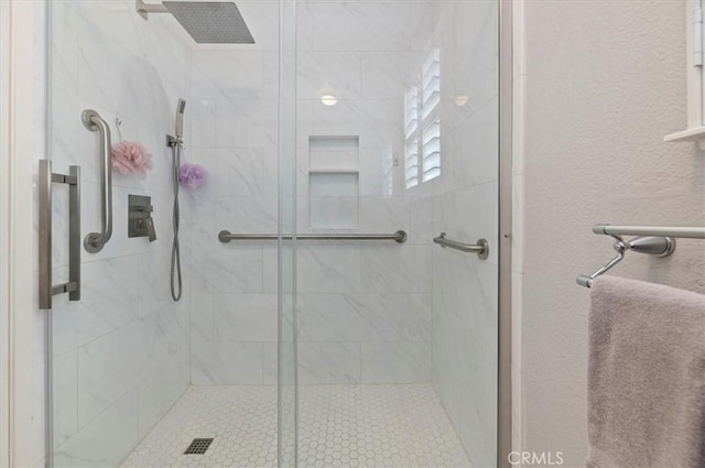 full bath with a shower stall