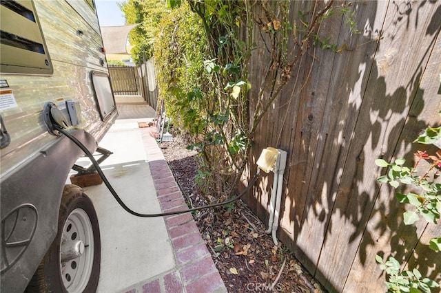 view of property exterior featuring fence
