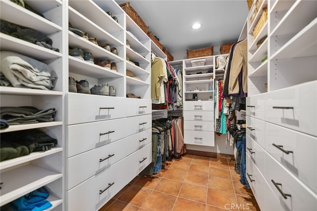 spacious closet featuring light tile patterned flooring