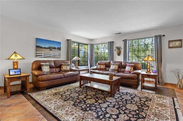 living room with visible vents and baseboards