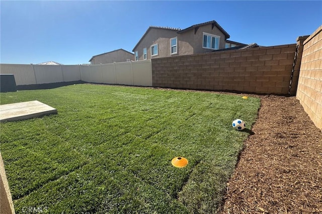 view of yard with cooling unit and a fenced backyard