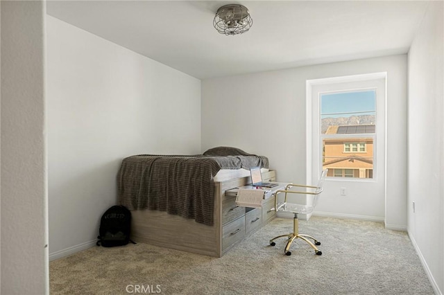 carpeted office space featuring baseboards