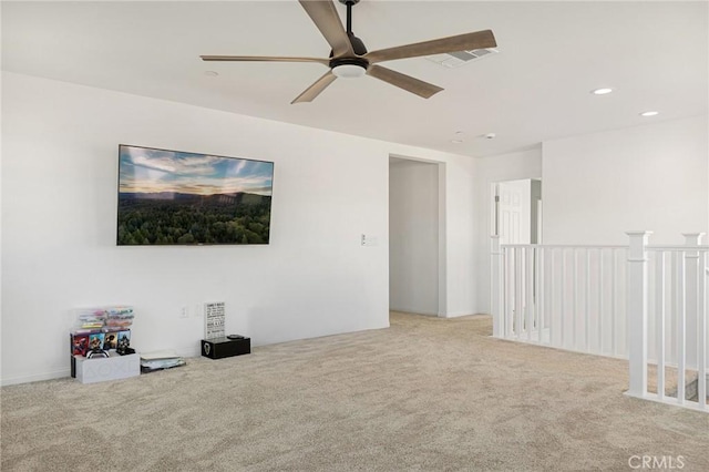 carpeted empty room featuring ceiling fan, recessed lighting, and visible vents