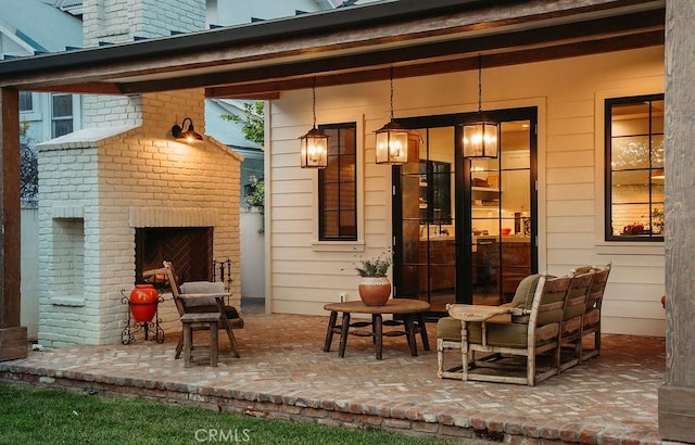 exterior space with an outdoor brick fireplace
