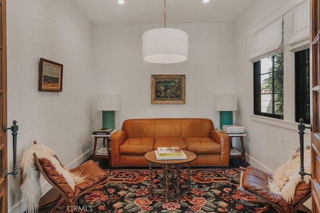 living room with recessed lighting and baseboards
