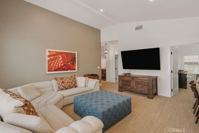 living room with visible vents, baseboards, recessed lighting, light colored carpet, and vaulted ceiling