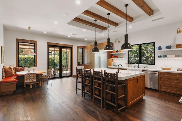 kitchen featuring open shelves, a sink, dishwasher, light countertops, and beamed ceiling