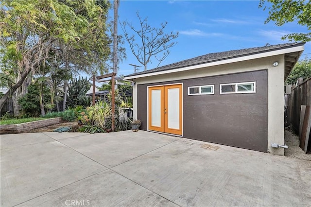 garage with fence