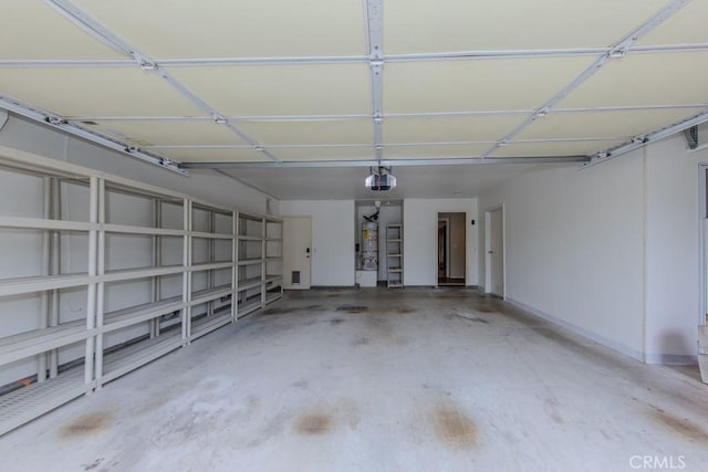 garage with water heater, baseboards, and a garage door opener