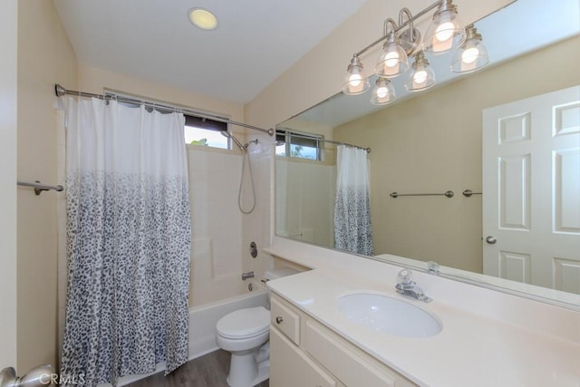full bathroom featuring vanity, shower / bath combo, toilet, and wood finished floors