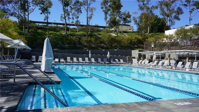 community pool featuring fence